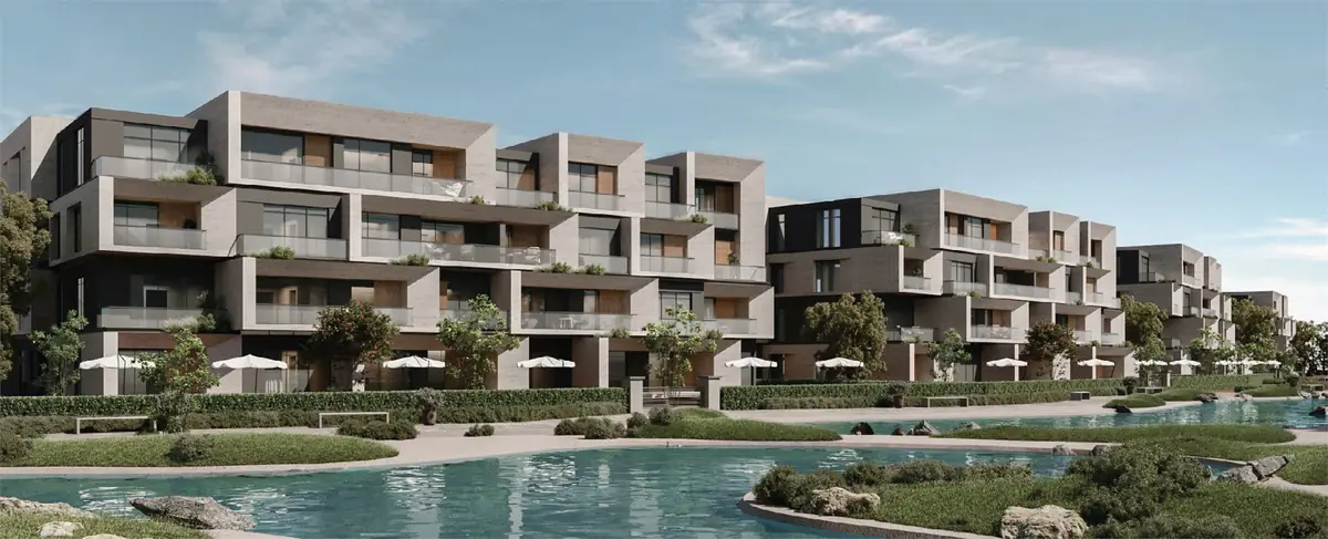 31 West – Stepped apartment terraces above a lagoon edged with parasols and lawns