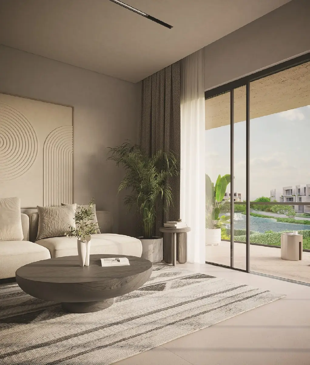 31 West – Living room with curved relief wall panel and sliding doors to the lagoon
