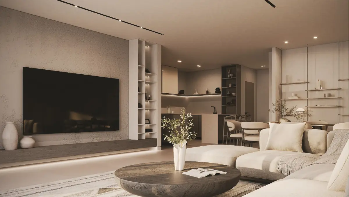31 West – Living room with large TV wall, open shelving and kitchen beyond