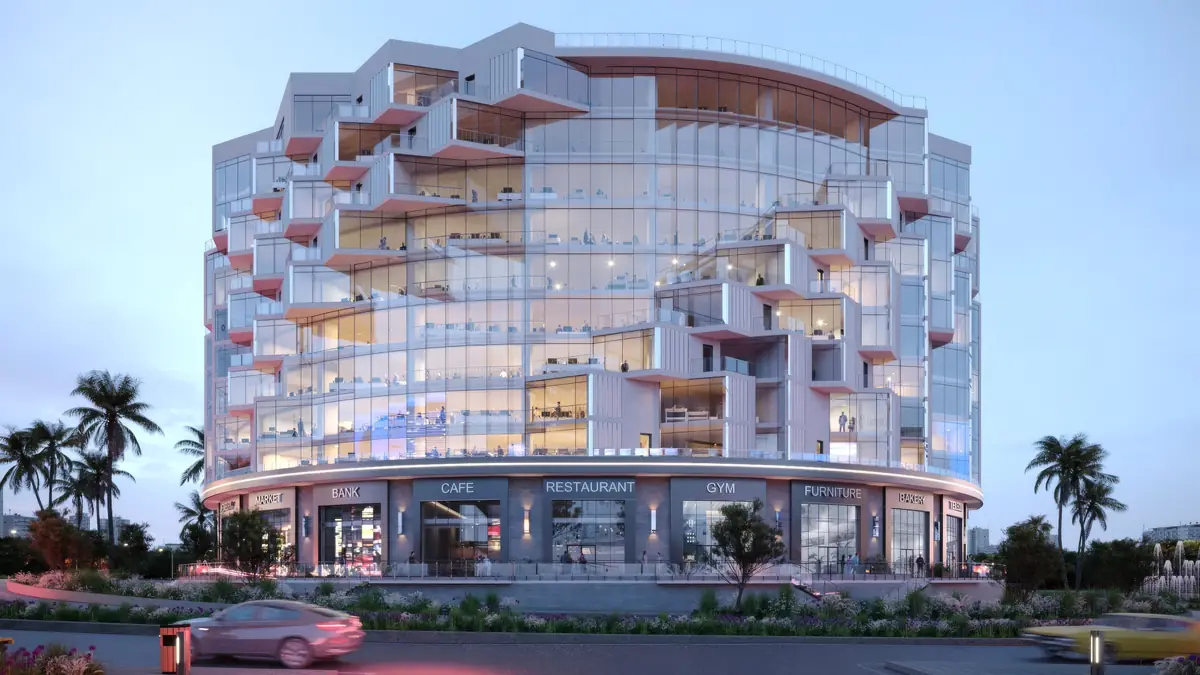 41 Business District – Curved glass building with projecting white balconies above ground-floor shops at dusk