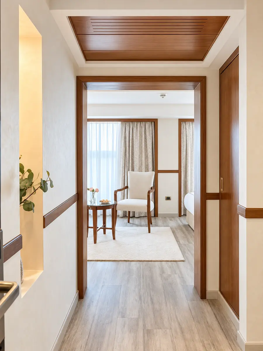 Amwaj Boat Renovation – Cabin entrance leading to an armchair corner on pale timber floors