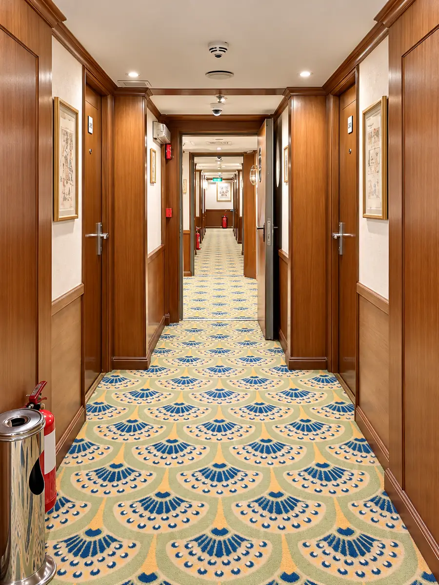 Amwaj Boat Renovation – Timber-panelled corridor with patterned blue and gold carpet
