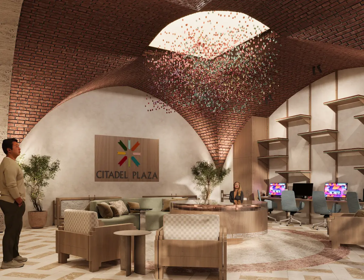 Citadel Plaza Sales Office – Skylight hung with a cloud of coloured strands above lounge chairs and workstations