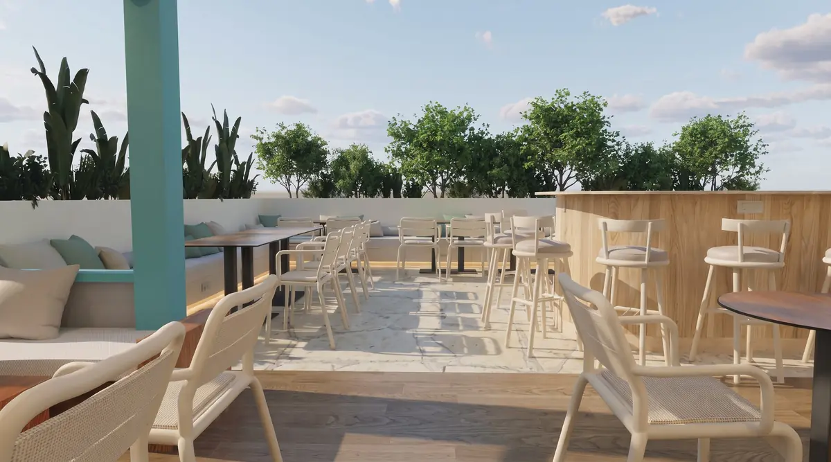 KARIBU Restaurant & Bar – Open-air terrace with built-in cushioned benches, bar stools and a turquoise column