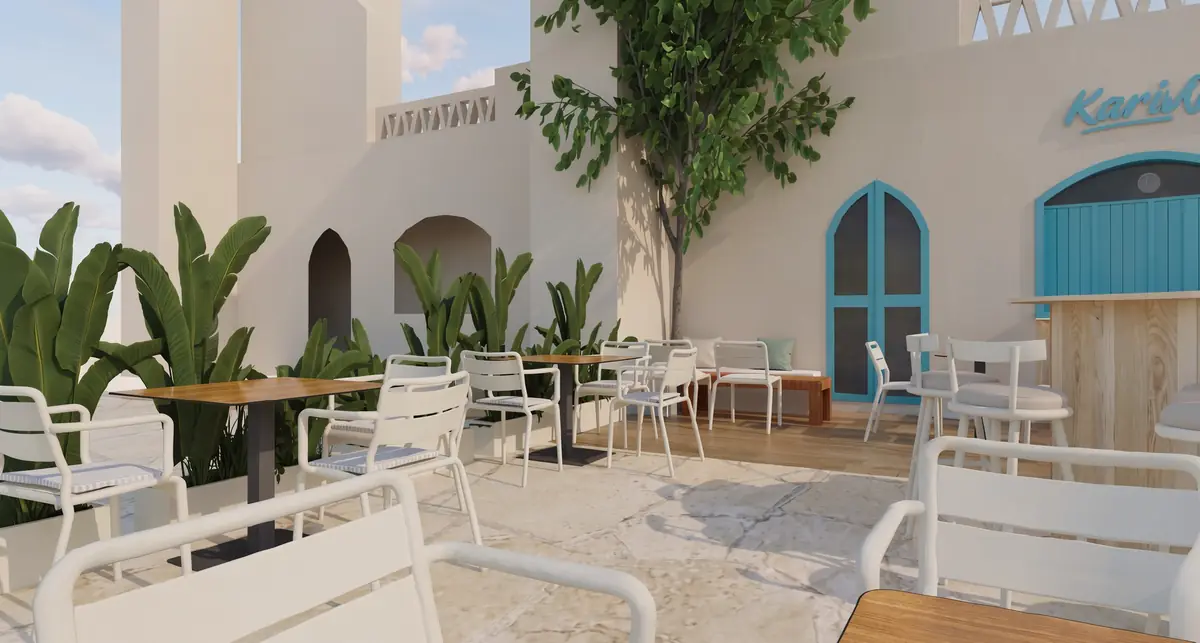 KARIBU Restaurant & Bar – Whitewashed courtyard walls with arched blue doors, tropical plants and white chairs