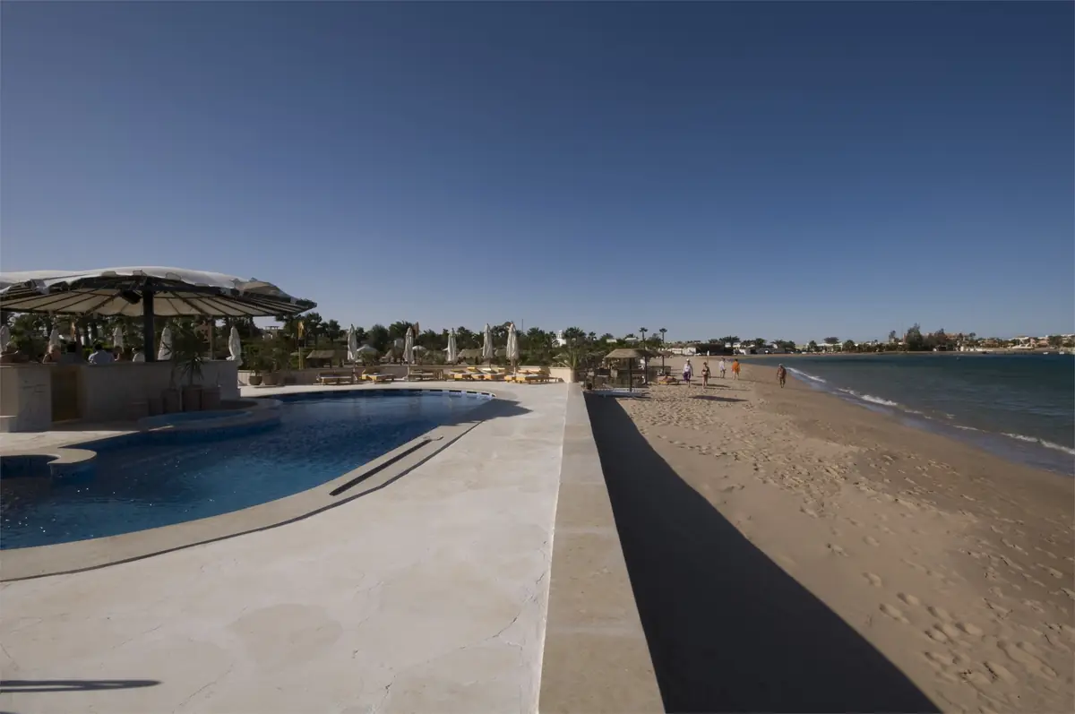 Lotus Bay Resort Renovation – Pool terrace and pool bar canopy beside the sandy beach and sea