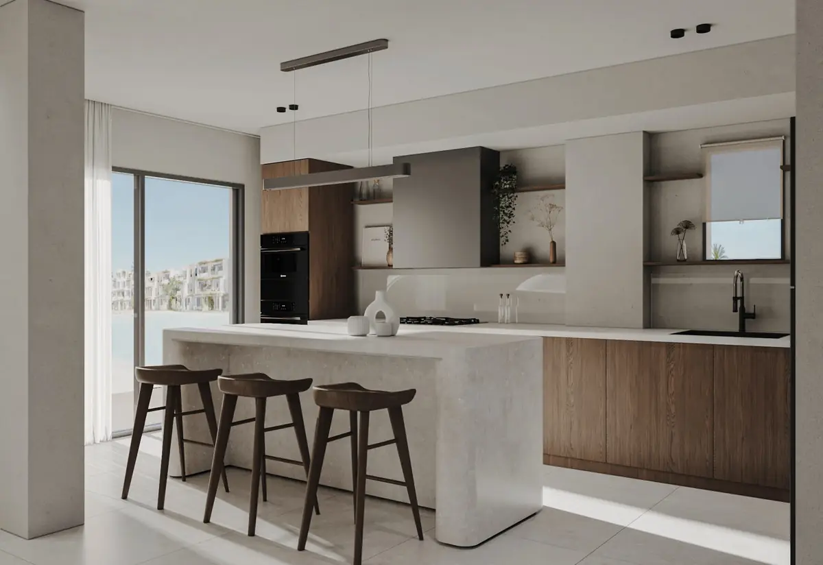 Masyaf Ras Al-Hekma – Open kitchen with a pale stone island, dark timber cabinets and three bar stools