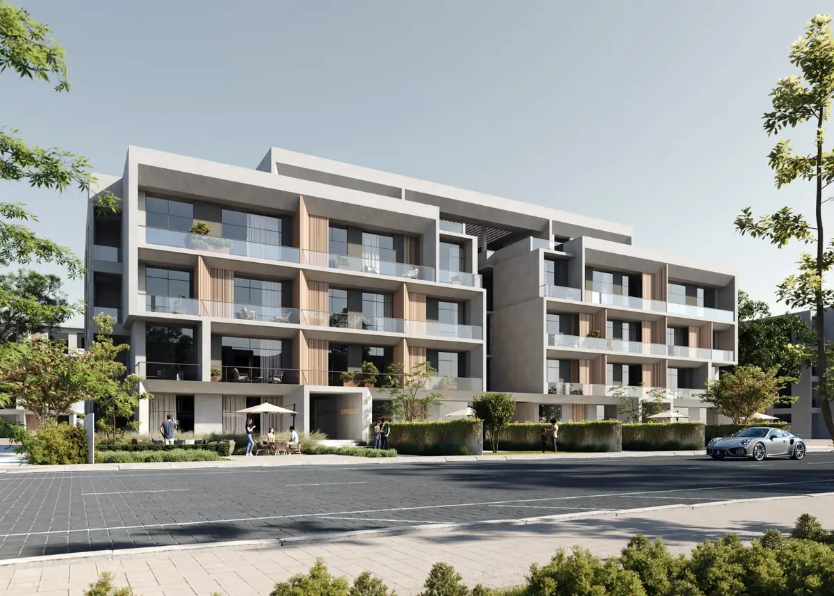 Mist – Apartment building along a paved street, with stepped balconies and timber panels