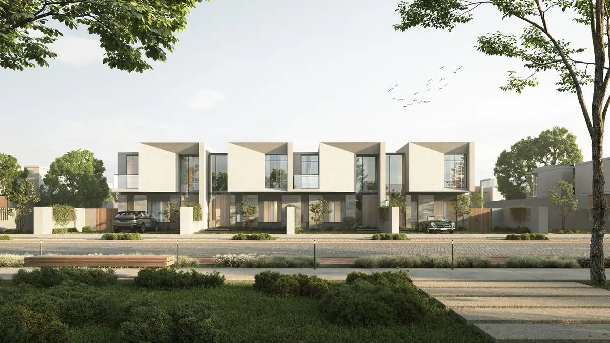 Mist – Street view of four townhouses with angled light stone frames and tall windows