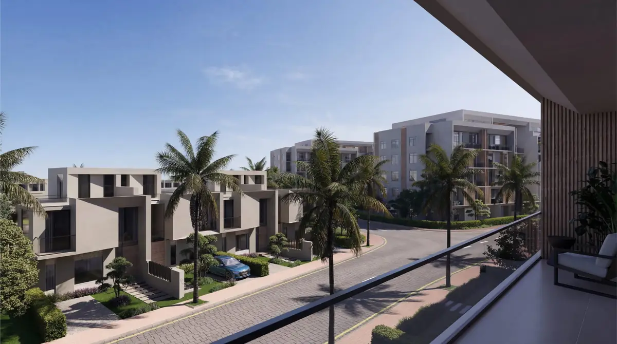 Mist – Covered balcony overlooking a palm-lined street with townhouses and apartment blocks