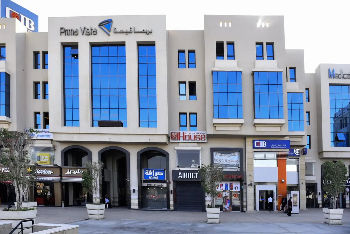 Prima Vista – Medical Office & Commercial Mall – Closer view of the arched shop entrances and the orange-trimmed bank entrance